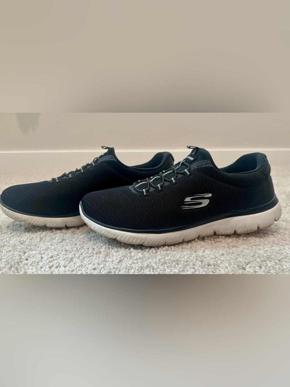 Skechers Women's Black Slip-On Athletic Shoes with White Sole